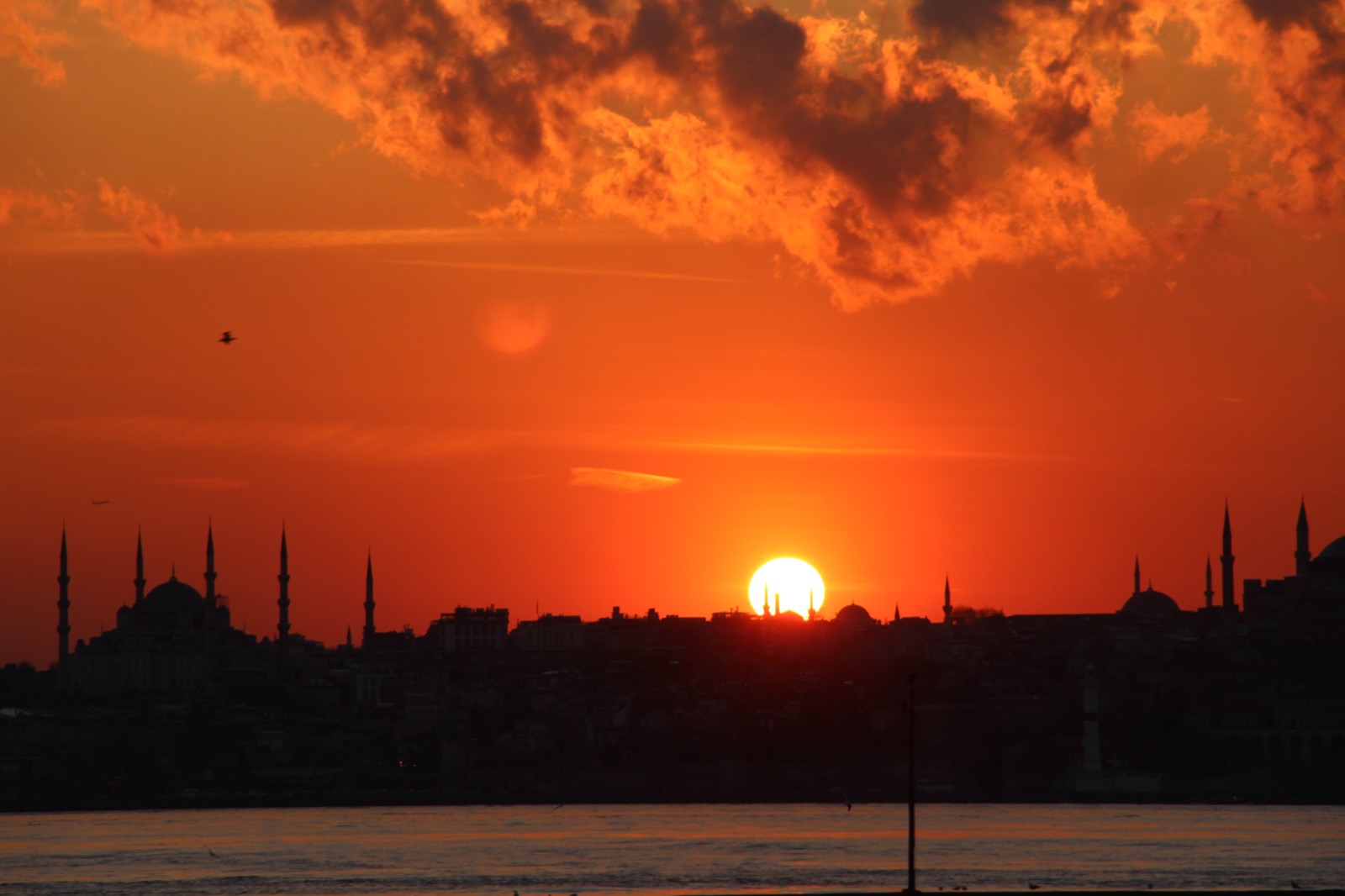 Istanbul skyline with mosque minarets silhouetted at sunset